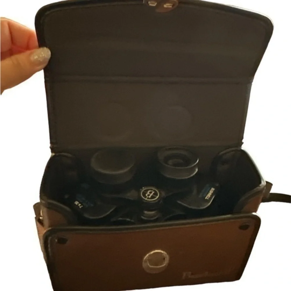 This listing is for a pair of Bushnell Insta Focus 7x35 binoculars with case.